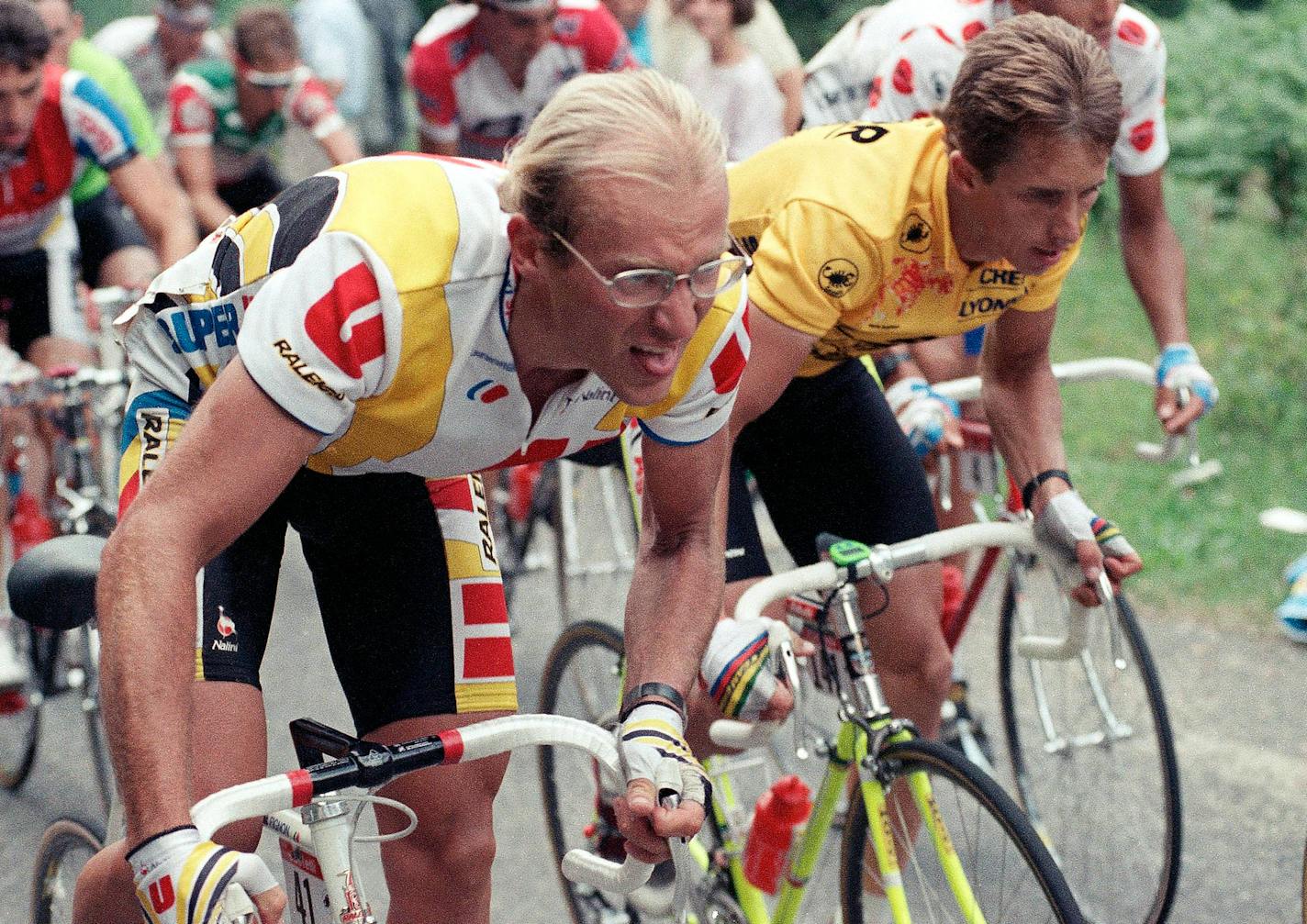 In this July 11, 1989 file photo, French rider Laurent Fignon, left, and American rider Greg LeMond, ascend a pass during the 10th stage of the Tour de France cycling race in the Pyrenees Mountains near Luchon, southwestern France. LeMond went on to win the Tour.