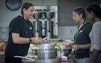 Sean Sherman, the 2018 James Beard award-winning Sioux Chef, showed Tajah Tempest, center, and Saba Andualem how to roll up meatballs at Urban Roots, 
