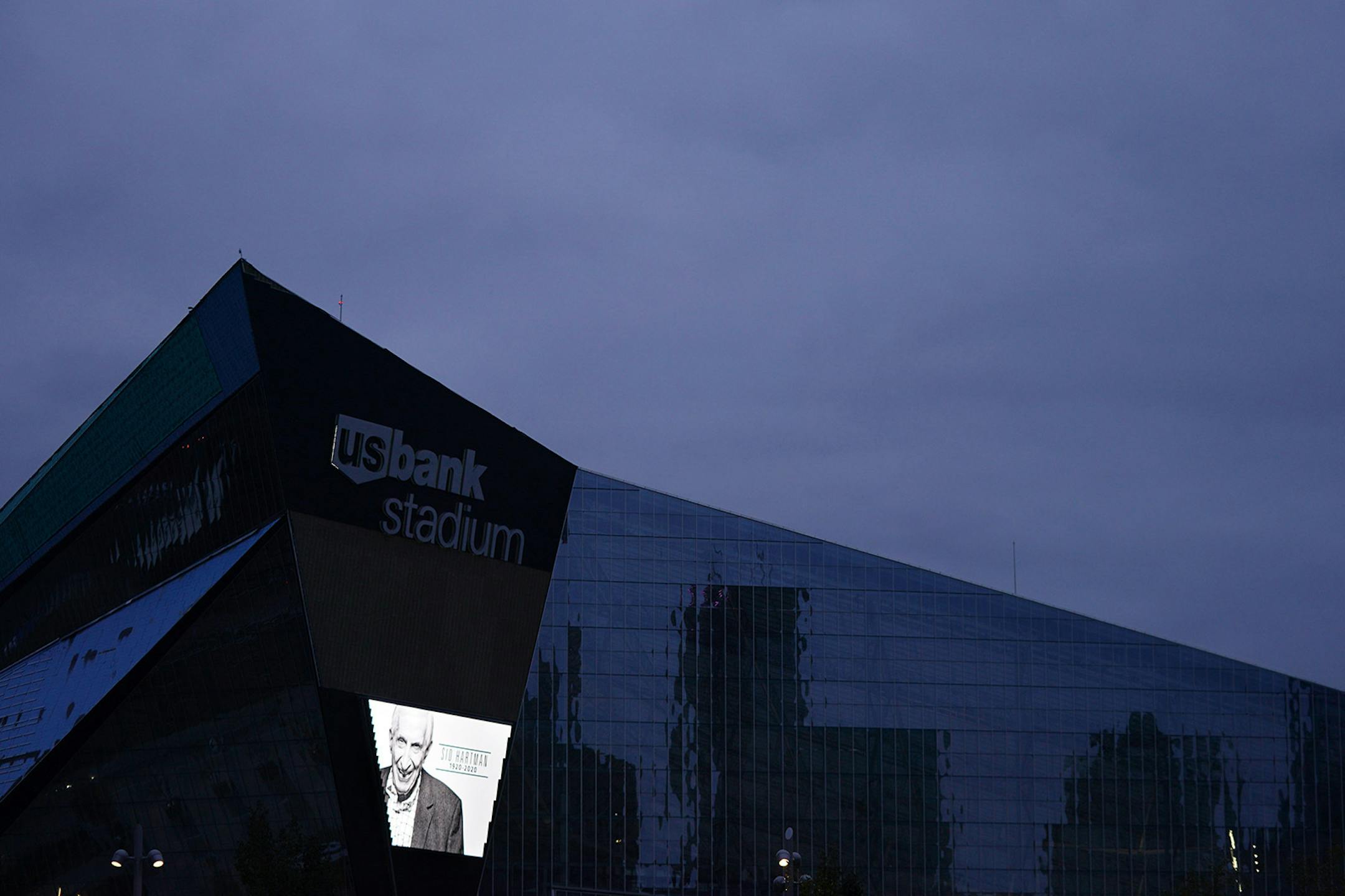 An image of longtime Star Tribune sports columnist Sid Hartman was projected on the video screen outside U.S. Bank Stadium noting his death Sunday evening following the Minnesota Vikings game against the Atlanta Falcons.
