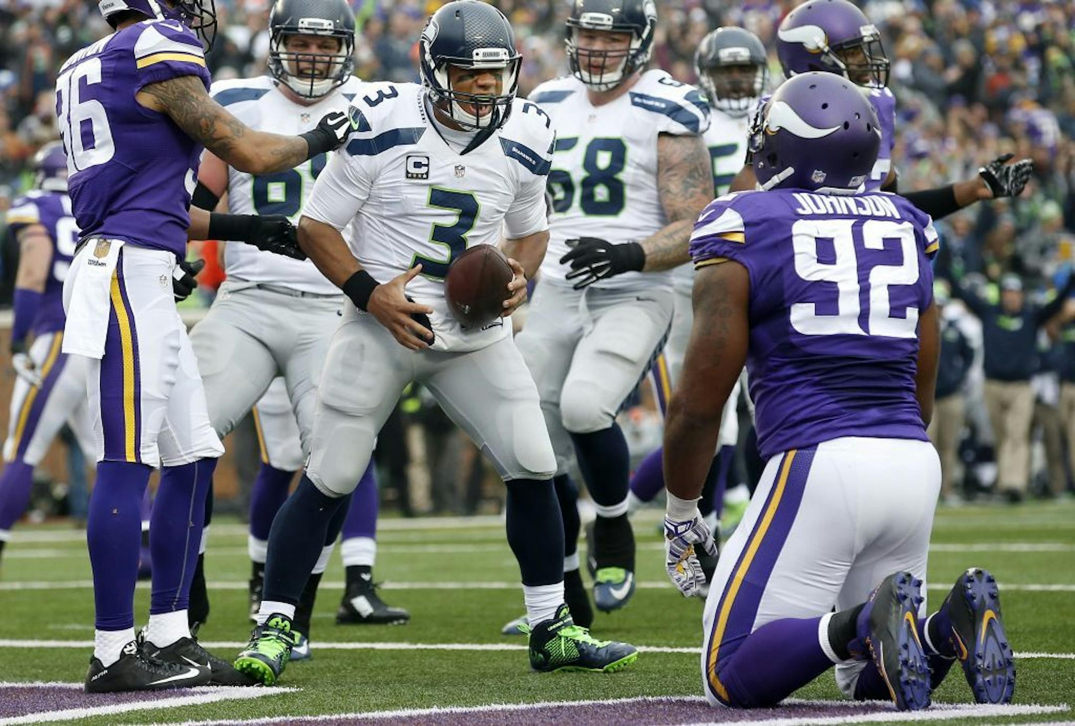 Seattle quarterback Russell Wilson (3) celebrated after scoring a touchdown in the second quarter.