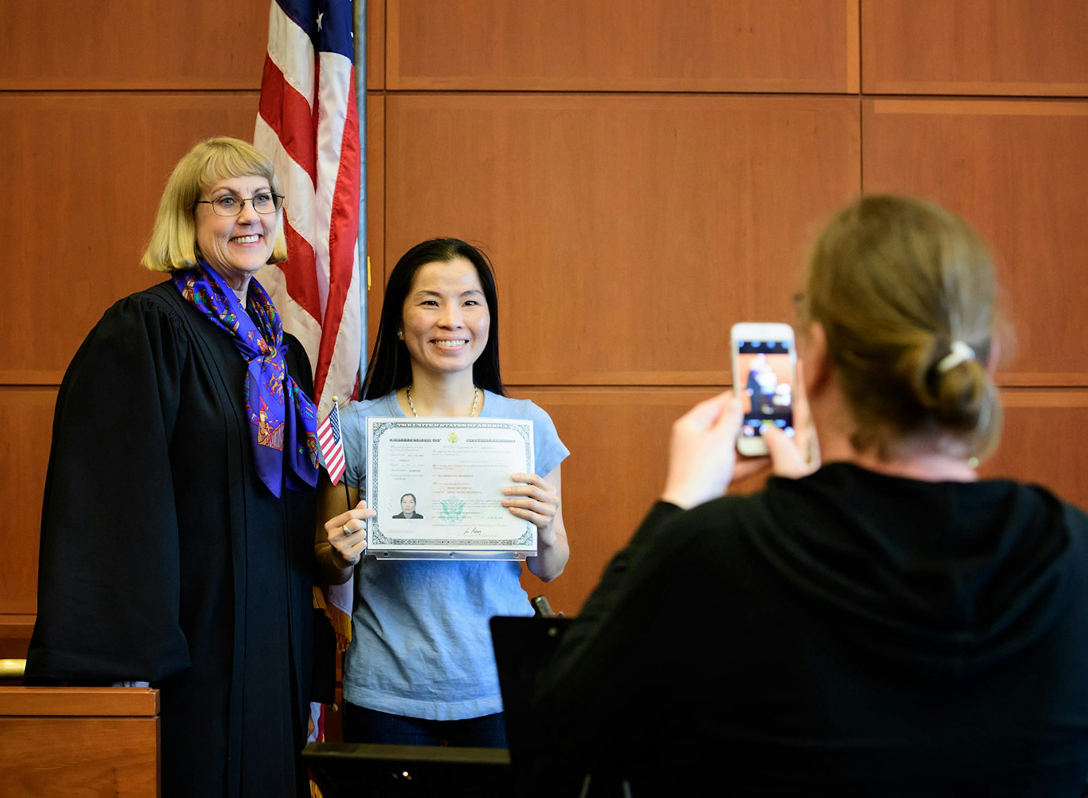 Trinh Thi Diem Vo of Vietnam had her photo taken with Judge Kathleen Sanberg after the naturalization ceremony.