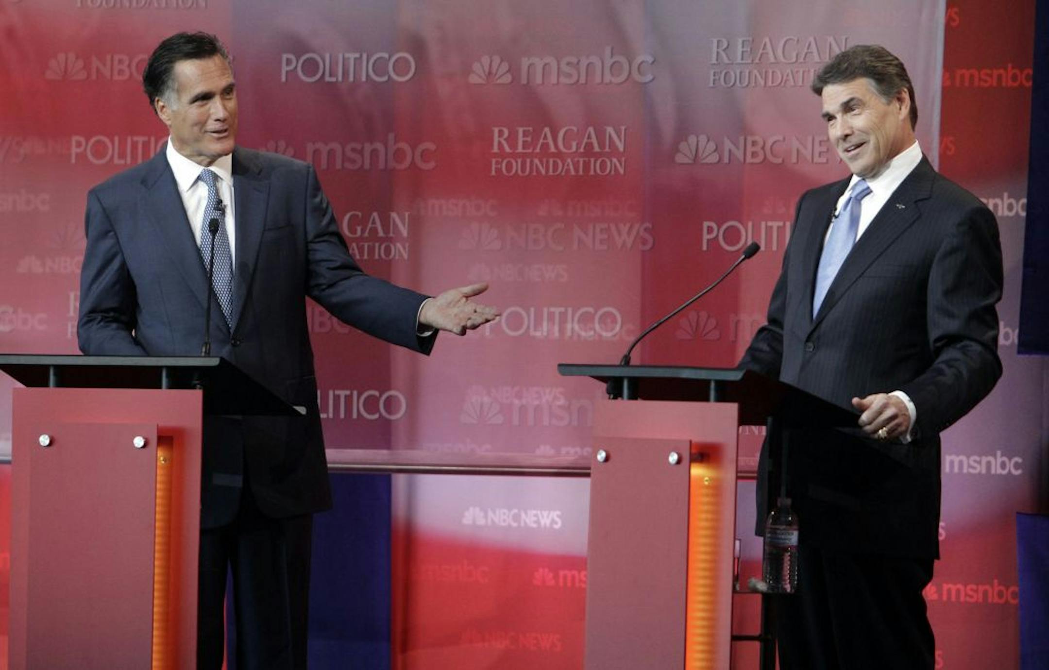 Mitt Romney, left, and Texas Gov. Rick Perry traded jabs during the Republican presidential debate Sept. 7 at the Reagan Presidential Library in Simi Valley, California.