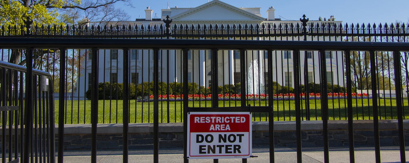 The White House is viewed from Pennsylvania Avenue behind two layers of security fencing on a Spring Day in Washington, on Tuesday, April 5, 2016.(AP Photo/Jon Elswick) ORG XMIT: APSTK