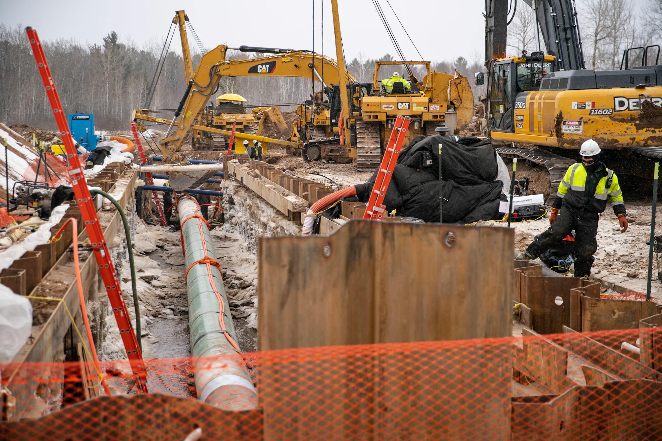 Workers laid down pipeline as part of Enbridge's Line 3 project on the Fond Du Lac Native American Reservation in Cloquet.
