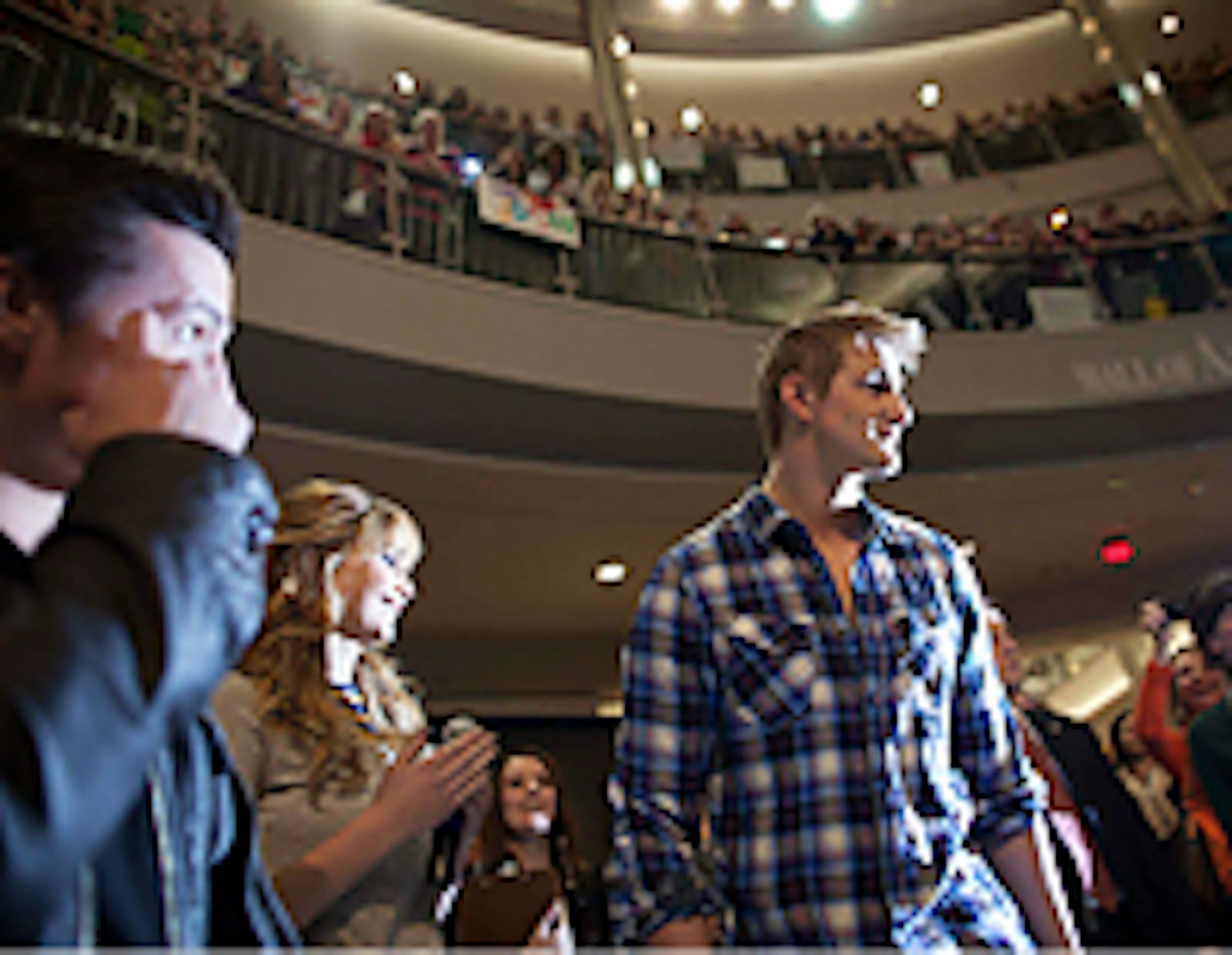 "Hunger Games" star Alexander Ludwig walked to the stage in the flicker of camera flashes at the Mall of America