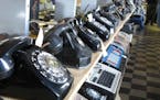 In a Saturday Nov. 12, 2011 photo, rows of old and newer telephones along with office switchboards are in the museum operated by members of the Parker