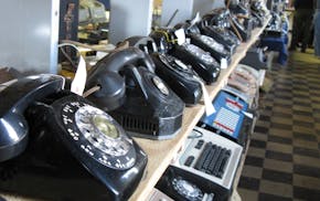 In a Saturday Nov. 12, 2011 photo, rows of old and newer telephones along with office switchboards are in the museum operated by members of the Parker