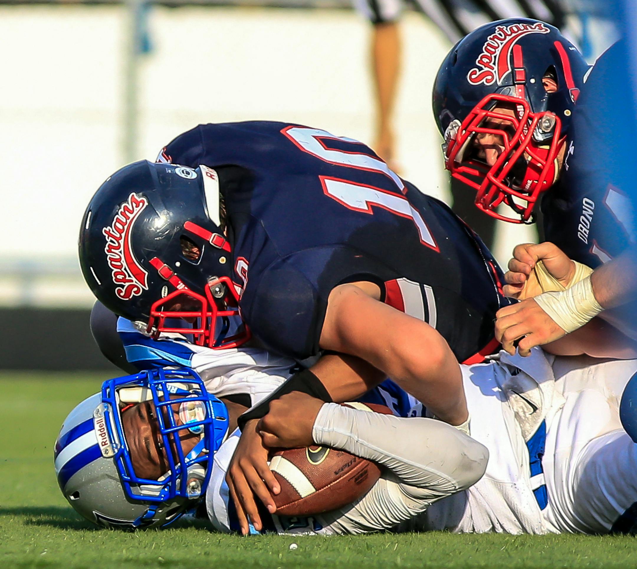 Orono defensive lineman Danny Striggow (10) on the tackle. Bloomington Jefferson at Orono, 8-31-18, Photo by Mark Hvidsten, SportsEngine