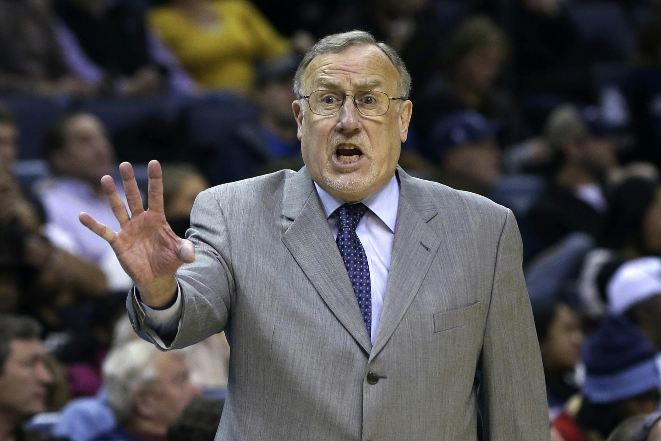 Minnesota Timberwolves coach Rick Adelman shouts in the second half of an NBA basketball game against the Memphis Grizzlies in Memphis, Tenn., Sunday, Dec. 15, 2013. The Timberwolves defeated the Grizzlies 101-93