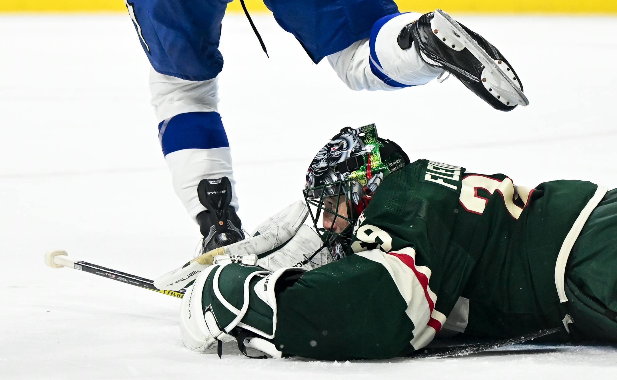 Tampa Bay Lightning center Anthony Cirelli (71) steps over Minnesota Wild goaltender Marc-Andre Fleury (29) during the first period Thursday, Jan. 4, 2024 at Xcel Energy Center in St. Paul, Minn.. ] AARON LAVINSKY • aaron.lavinsky@startribune.com