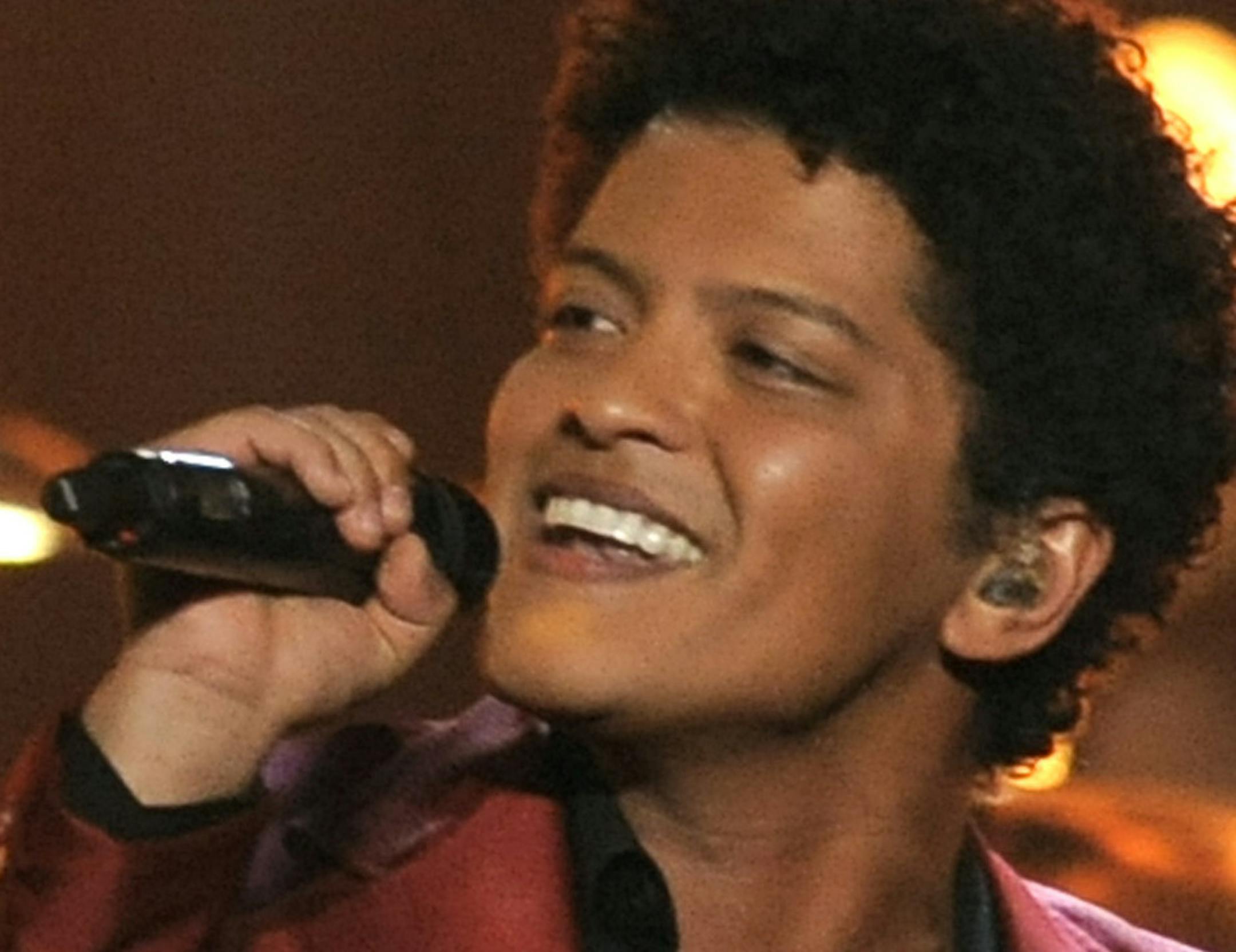 FILE - In this May 19, 2013 file photo, Bruno Mars performs at the Billboard Music Awards in Las Vegas. Mars' "Treasure," is one of the top songs of the summer. (Photo by Chris Pizzello/Invision/AP, File)