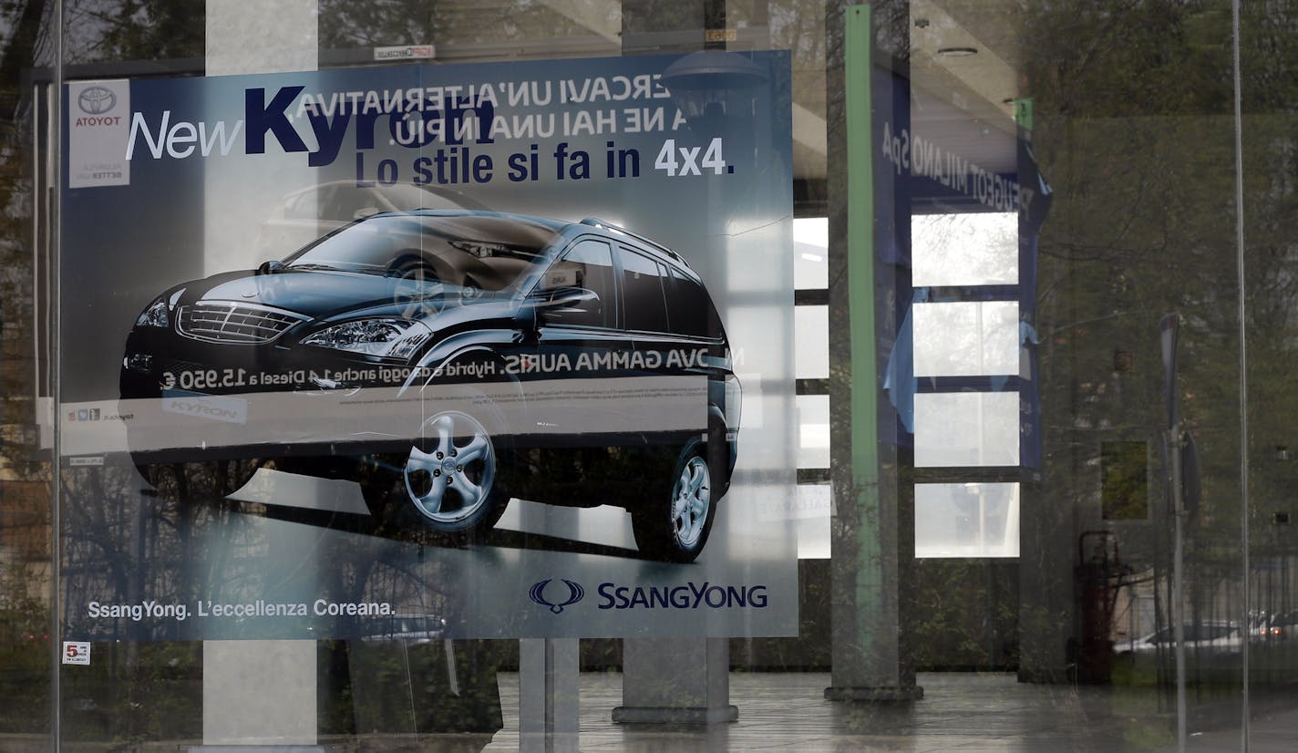 An empty car dealer in Milan, Italy, Thursday, April 18, 2013. Europe's auto market is in freefall. Once the motor for Europe's economy, the car industry has fallen victim to the region's widening recession and soaring unemployment. Carmakers have suffered 18 straight months of declining sales as people worried that they might soon be out of a job put off making big purchases. New car sales across Europe slid 10 percent in the first quarter of 2013 to 2.9 million, down from 3.3 million in 2012,