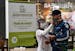In this June 9, 2020 photo, a nurse measures the body temperature of a shopper at the El Tesoro mall, amid the new coronavirus pandemic, in Medellin, 