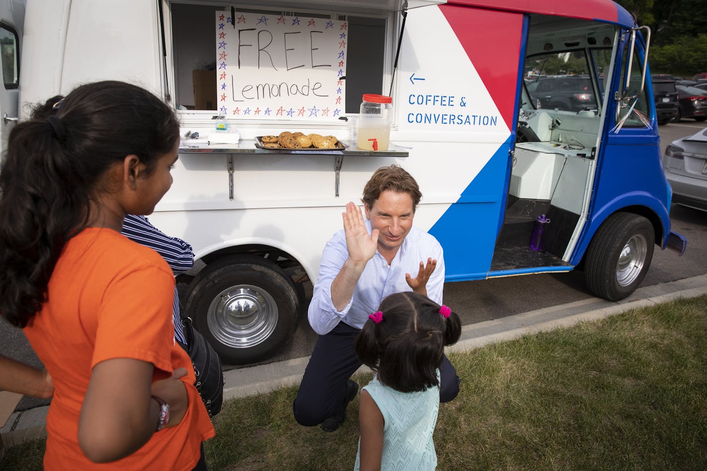 Dean Phillips, Democratic candidate for Congress, gave out free cookies and lemonade from his revamped 1960s milk truck at Music in Plymouth.