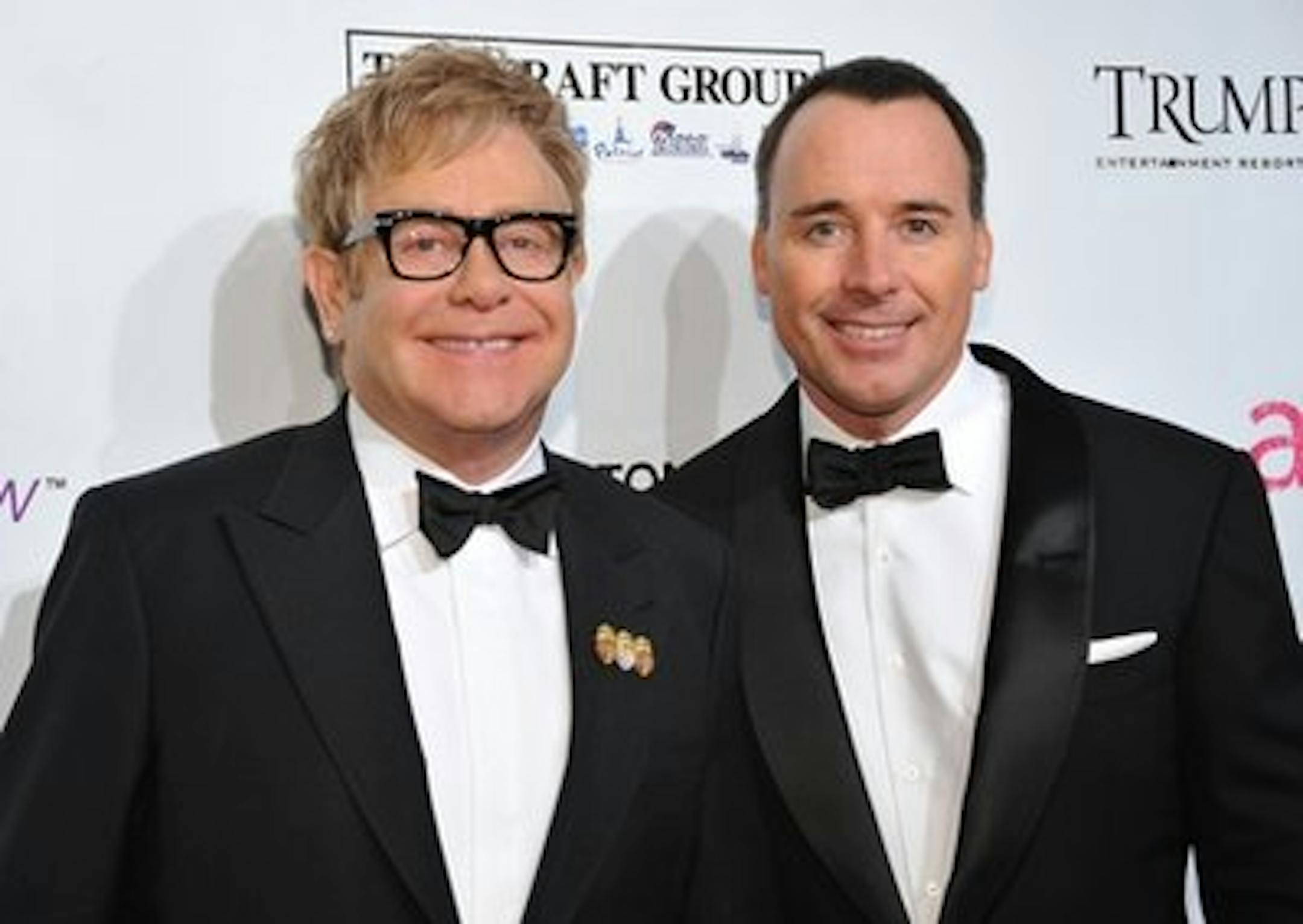 FILE - In this Oct. 18, 2010 file photo, Sir Elton John, left, and husband David Furnish attend the Ninth Annual Elton John AIDS Foundation benefit 'An Enduring Vision' at Cipriani Wall Street in New York. John and Furnish have become parents to a 7-pound, 15-ounce baby boy born on Christmas Day. The news was first reported Monday night, Dec. 27, 2010 by USMagazine.com and confirmed to The Associated Press by John's Los Angeles-based publicist. (AP Photo/Evan Agostini, File)