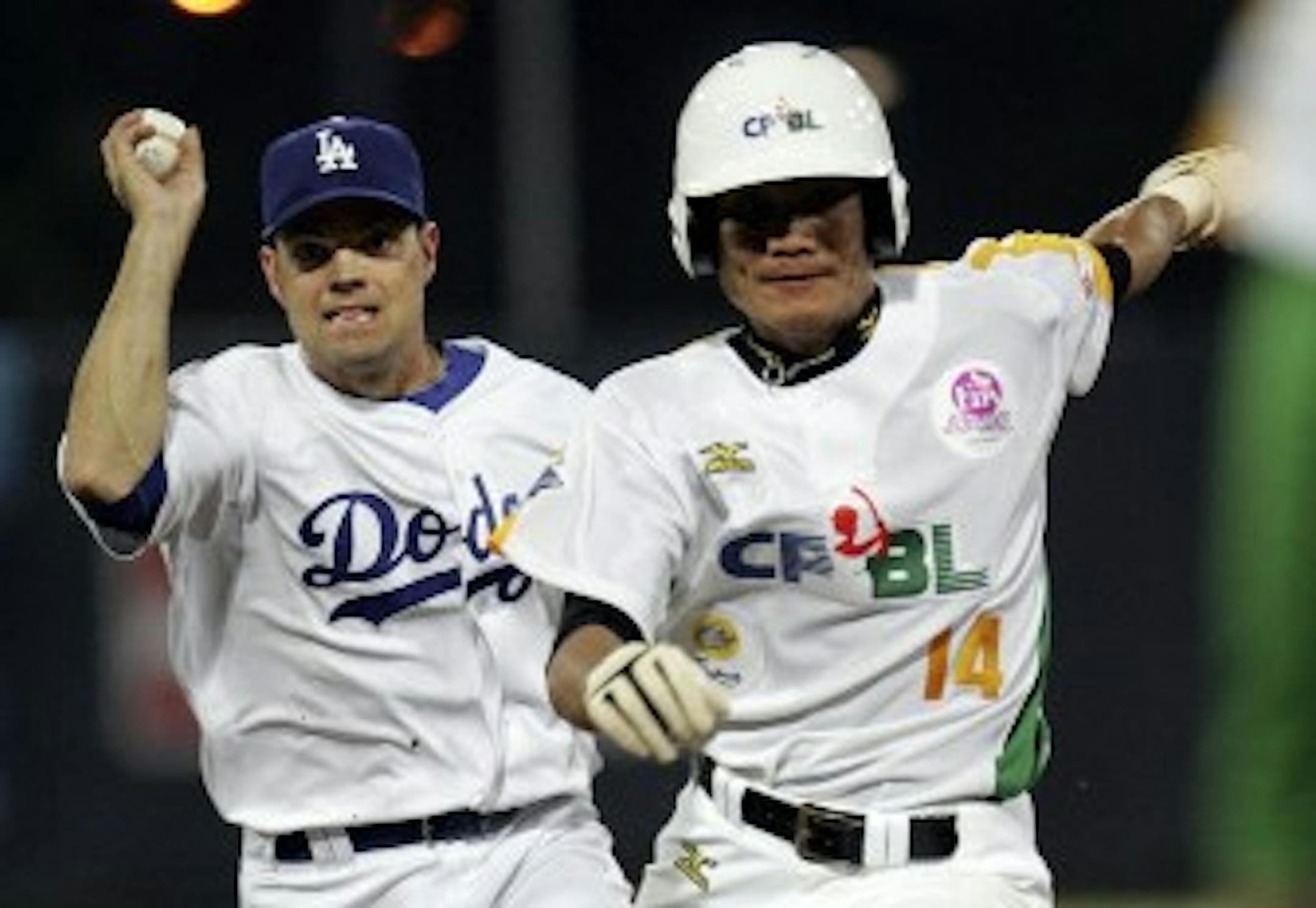 Jamey Carroll ran after Taiwan all-star S.W. Wang during an exhibition. Not pictured: Carroll chasing Tsuyoshi Nishioka back to Japan.