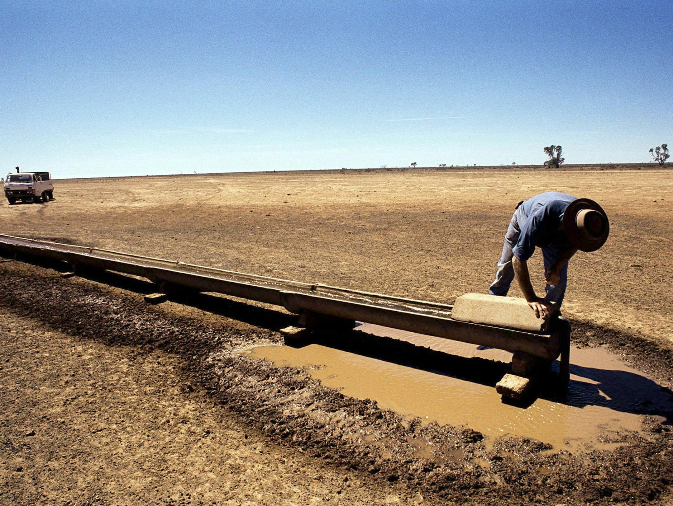 (NYT23) UNDATED -- Feb. 2, 2007 -- CLIMATE-CHANGE-2 -- A farmer on his drought-stricken property near the outback town of Deniliquin, Australia, in a Jan. 15, 2007 Greenpeace photo. In a bleak and powerful assessment of the future of the planet, the leading international network of climate change scientists has concluded for the first time that global warming is "unequivocal" and that human activity is the main driver, "very likely" causing most of the rise in temperatures since 1950. (Greenpeac