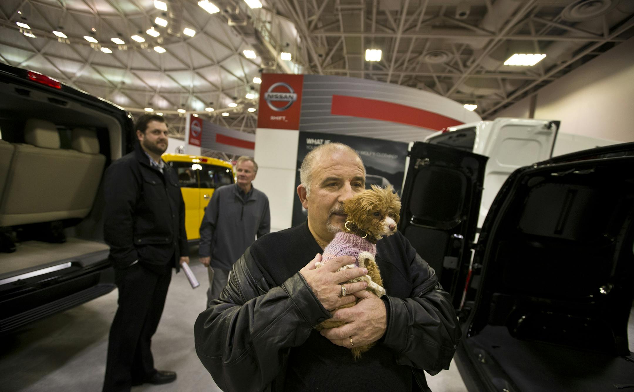 "Do youn like it?" asked Jacob Tselniker to his service dog Sophie as he looked at a Nissan van during the Twin Cities Auto Show at the Minneapolis Convention Center in Minneapolis, Minn., on Friday, March 14, 2014. ] (RENEE JONES SCHNEIDER ‚Ä¢ reneejones@startribune.com) All I know is he said the puppy was a service dog