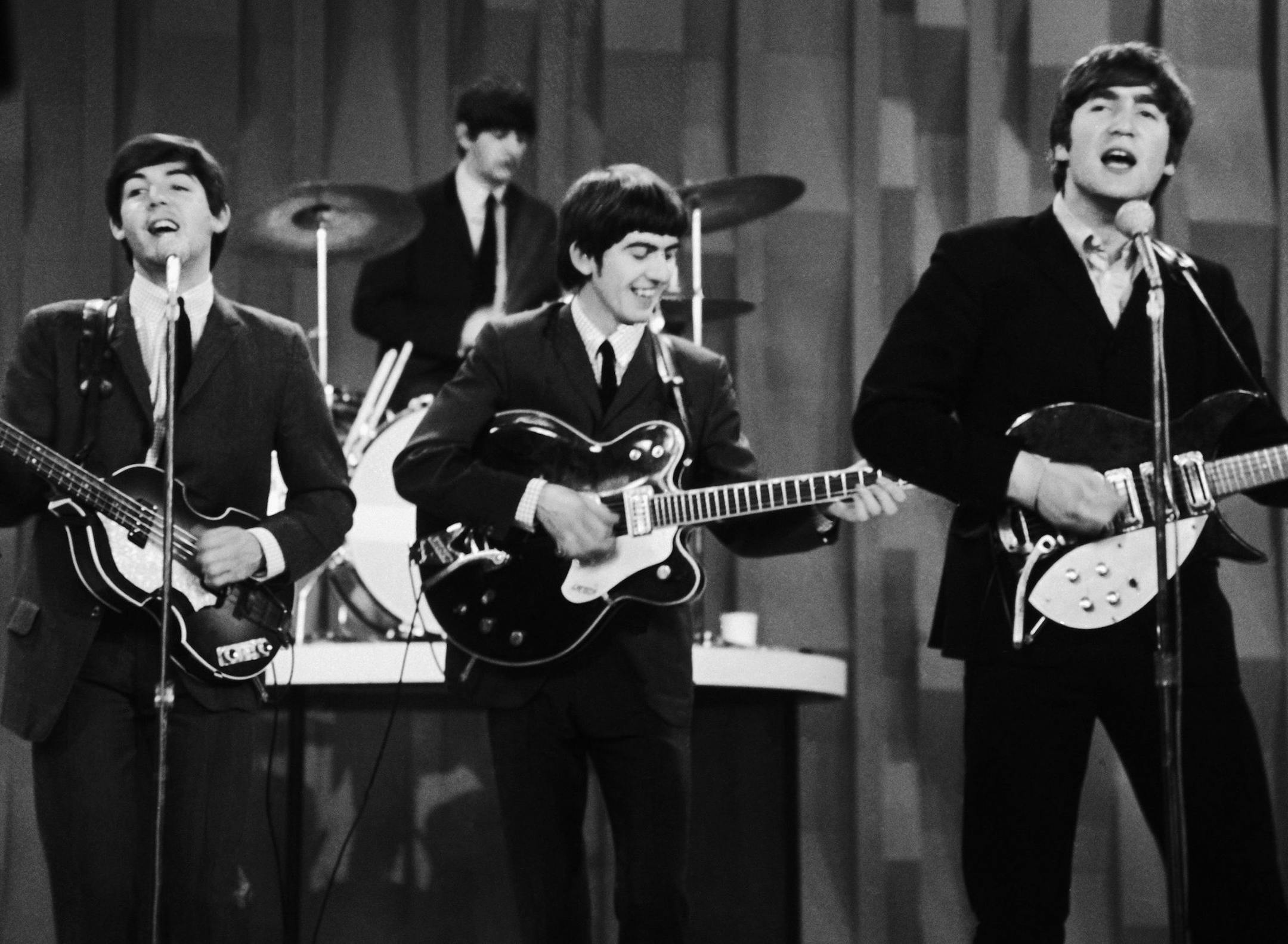FILE - In this Feb. 9, 1964 file photo, The Beatles perform on the CBS "Ed Sullivan Show" in New York. Ringo Starr plays drums, rear, and playing guitars from left are Paul McCartney, George Harrison and John Lennon. An estimated 73 million Americans tuned in, the largest ever for a TV show at the time, or three times the amount of people who watched the latest "American Idol" finale, according to the Nielsen Co. (AP Photo/Dan Grossi/ file)