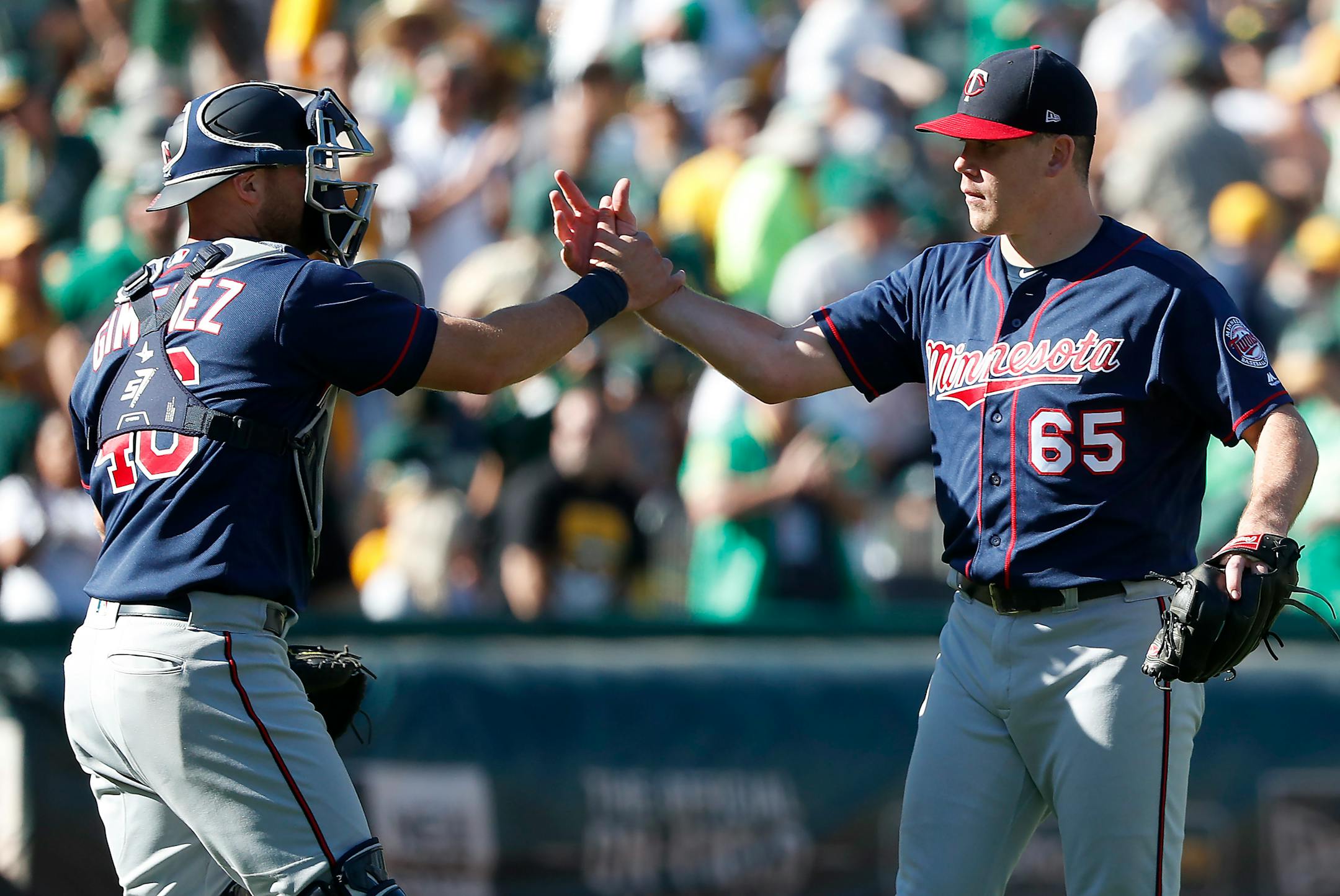 Twins catcher Chris Gimenez congratulated pitcher Trevor May after a victory over the Athletics