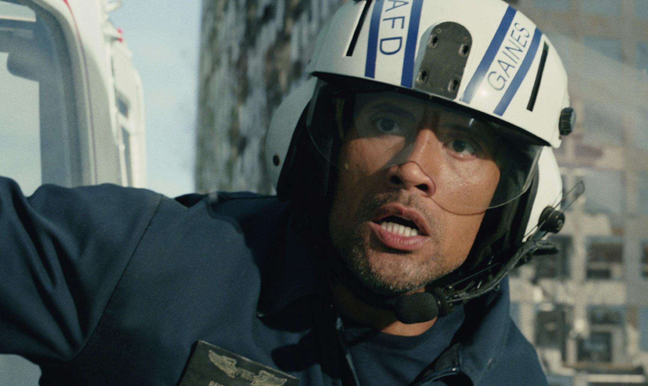 This photo provided by Warner Bros. Pictures shows Dwayne Johnson as Ray in a scene from the action thriller, "San Andreas." The movie releases in theaters on May 29, 2015. (Courtesy Warner Bros. Pictures via AP)