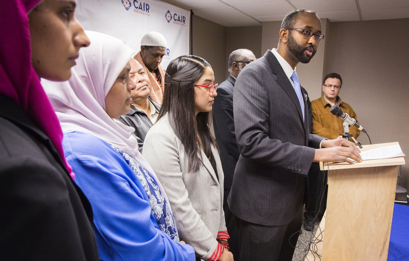 Jaylani Hussein, executive director of the Council on American-Islamic Relations, Minnesota chapter (CAIR), and members of the local Muslim and Somali community raise concerns about the Department of Justice's new pilot program to counter violent extremism during a press conference in Minneapolis on Tuesday, February 17, 2015. ] LEILA NAVIDI leila.navidi@startribune.com /