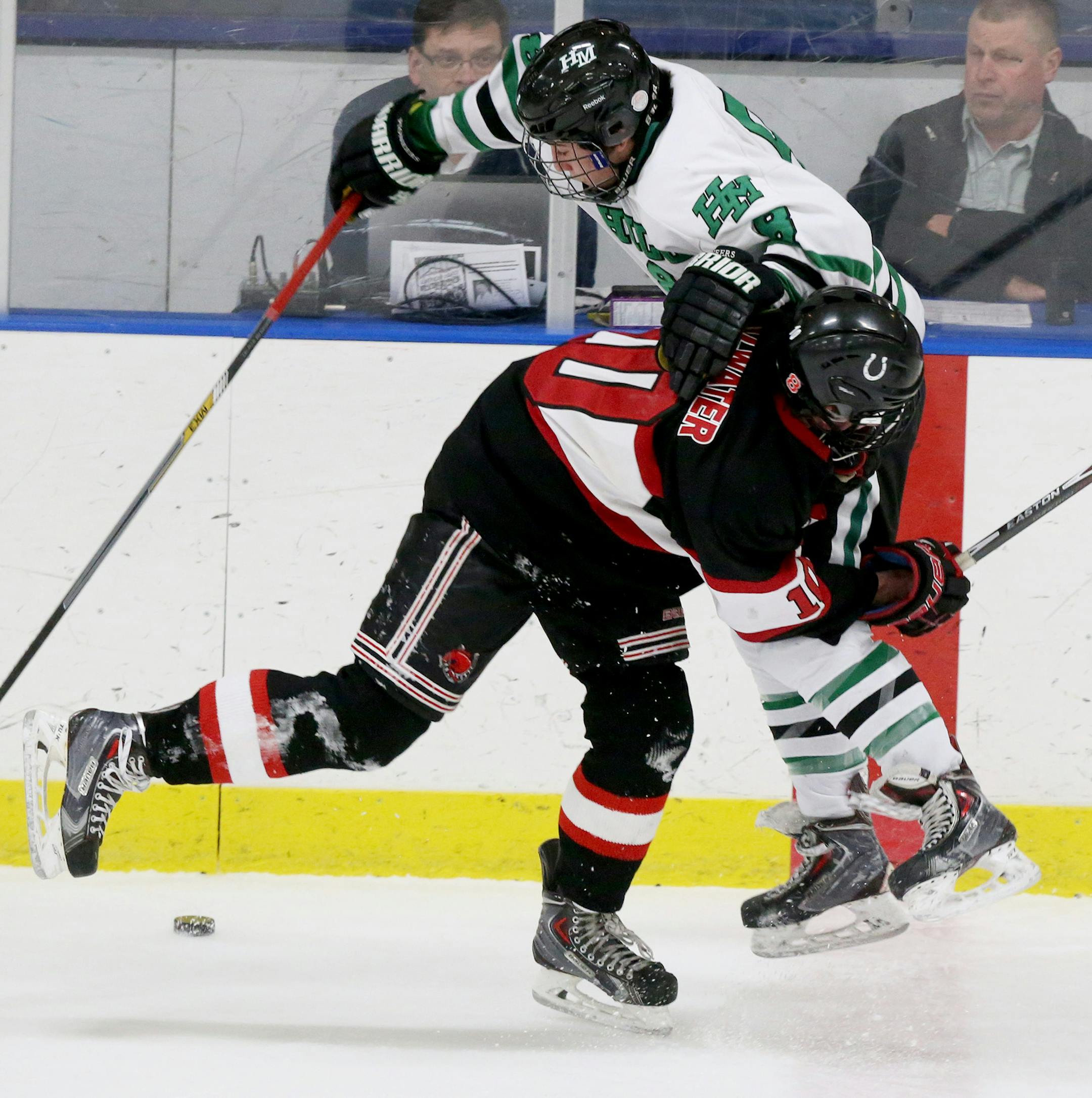 While airborn Hill-Murray's Luke Ranallo (8) tries to control the puck against Stillwater's Jackson Cates (10) during the first period of the 2A boys' hockey section final Friday, Feb. 27, 2015, at Aldrich Arena in Maplewood, MN ](DAVID JOLES/STARTRIBUNE)djoles@startribune.com Class 2A boys' hockey section final, Hill-Murray vs. Stillwater