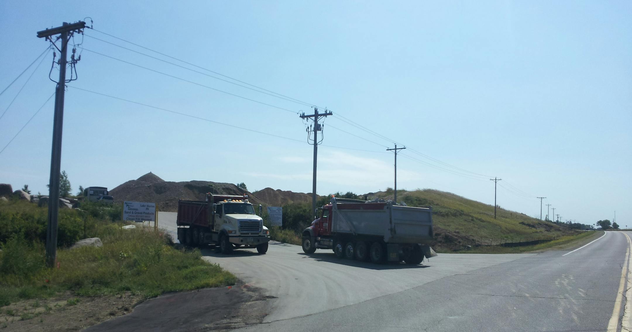 Photo courtesy of John Osborne Gravel trucks drove in and out of the Midwest Asphalt gravel mine in Lakeville.