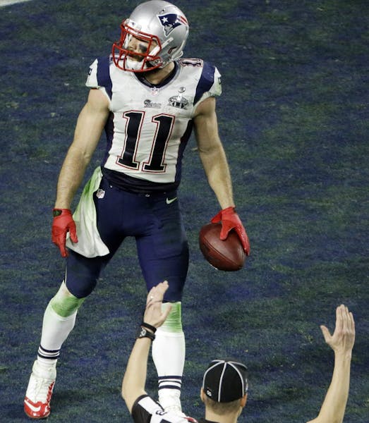 New England Patriots wide receiver Julian Edelman (11) moves in the end zone after making a touchdown catch against the Seattle Seahawks during the se