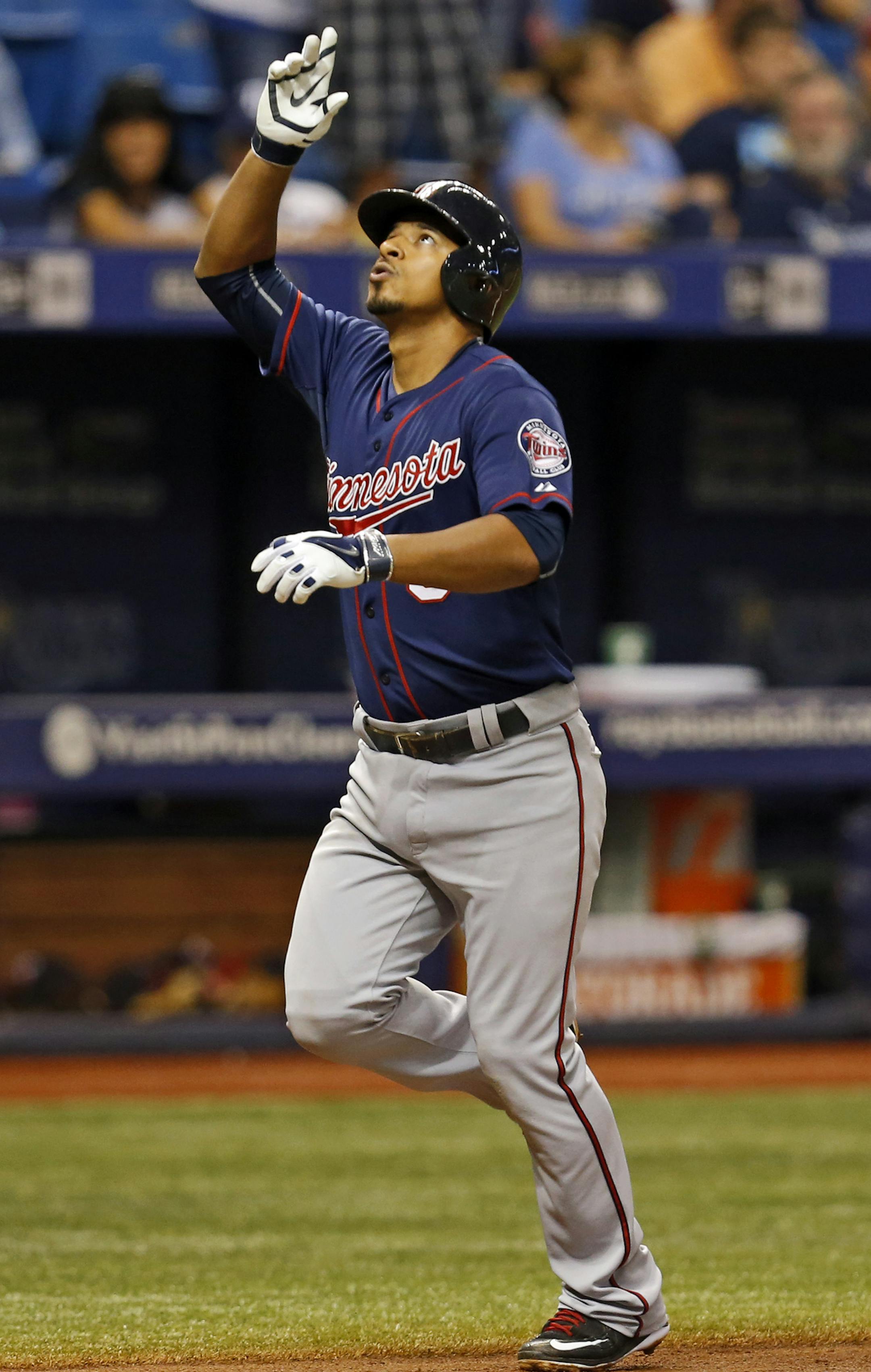 Minnesota Twins' Eduardo Escobar celebrates his solo home run during the fourth inning of a baseball game against the Tampa Bay Rays on Thursday, Aug. 27, 2015, in St. Petersburg, Fla. (AP Photo/Mike Carlson)