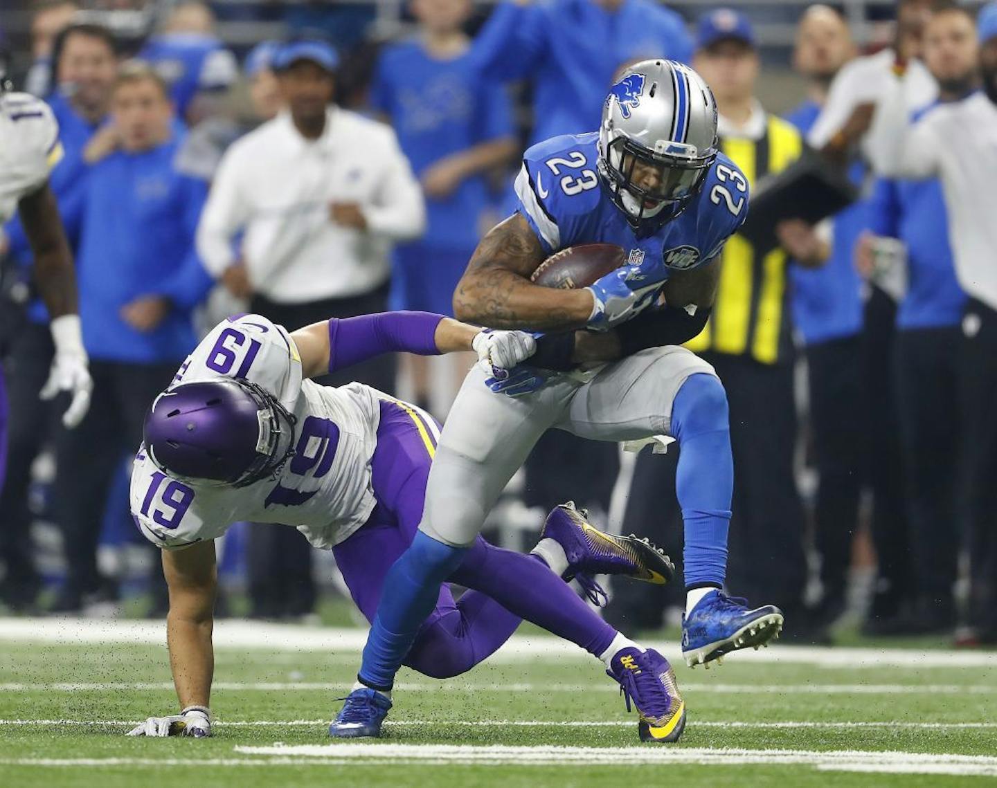 Detroit Lions cornerback Darius Slay (23) intercepts a pass intended for Minnesota Vikings wide receiver Adam Thielen (19) in the fourth quarter of an NFL football game in Detroit, Thursday, Nov. 24, 2016.