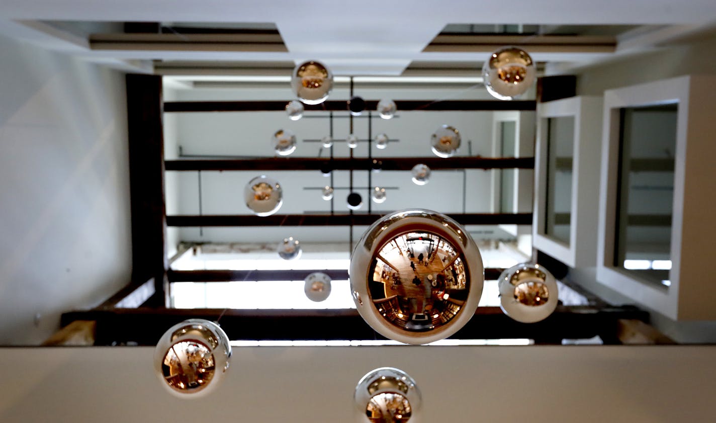 Glass blown raindrops in the atrium at The Hewing Hotel in Minneapolis. The raindrops were made by Foci in Minneapolis. ] CARLOS GONZALEZ cgonzalez@startribune.com - November 15, 2016, Minneapolis, MN, The Hewing Hotel is one of the most highly anticipated new hotels to open in Minneapolis. The 124-room hotel will officially open its doors Wednesday