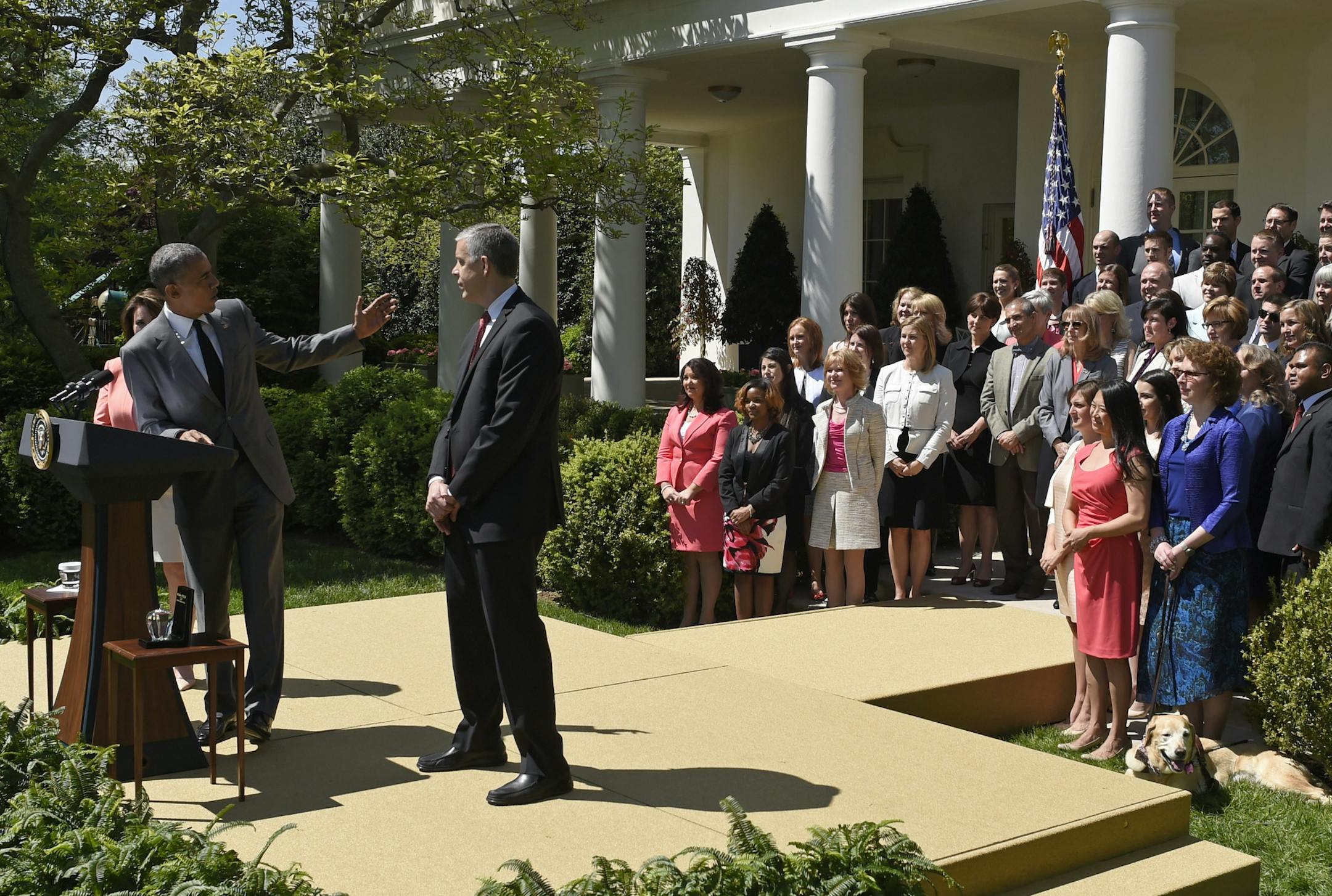 President Barack Obama turns back to look at the National Teacher of the Year and finalists during an event in the Rose Garden of the White House in Washington, Wednesday, April 29, 2015. Obama thanked the teachers for their hard work and dedication each and every day in the classroom. Standing with Obama is Education Secretary Arne Duncan and 2015 National Teacher of the Year Shanna Peeples, left, of Amarillo, Texas. (AP Photo/Susan Walsh)