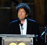 FILE - In this Feb. 6, 2015 file photo, Bob Dylan accepts the 2015 MusiCares Person of the Year award at the 2015 MusiCares Person of the Year show in