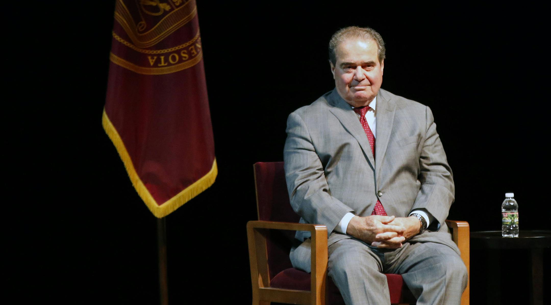 FILE - In this Oct. 20, 2015, file photo, U.S. Supreme Court Justice Antonin Scalia waits during an introduction before speaking at the University of Minnesota as part of the law school's Stein Lecture series in Minneapolis. The presence of three women on the Supreme Court isn't enough to persuade Scalia that the court has become a diverse body. In remarks Wednesday, Nov. 11, in Philadelphia, Scalia noted that four of its members are from New York City, a fifth from New Jersey and two more from