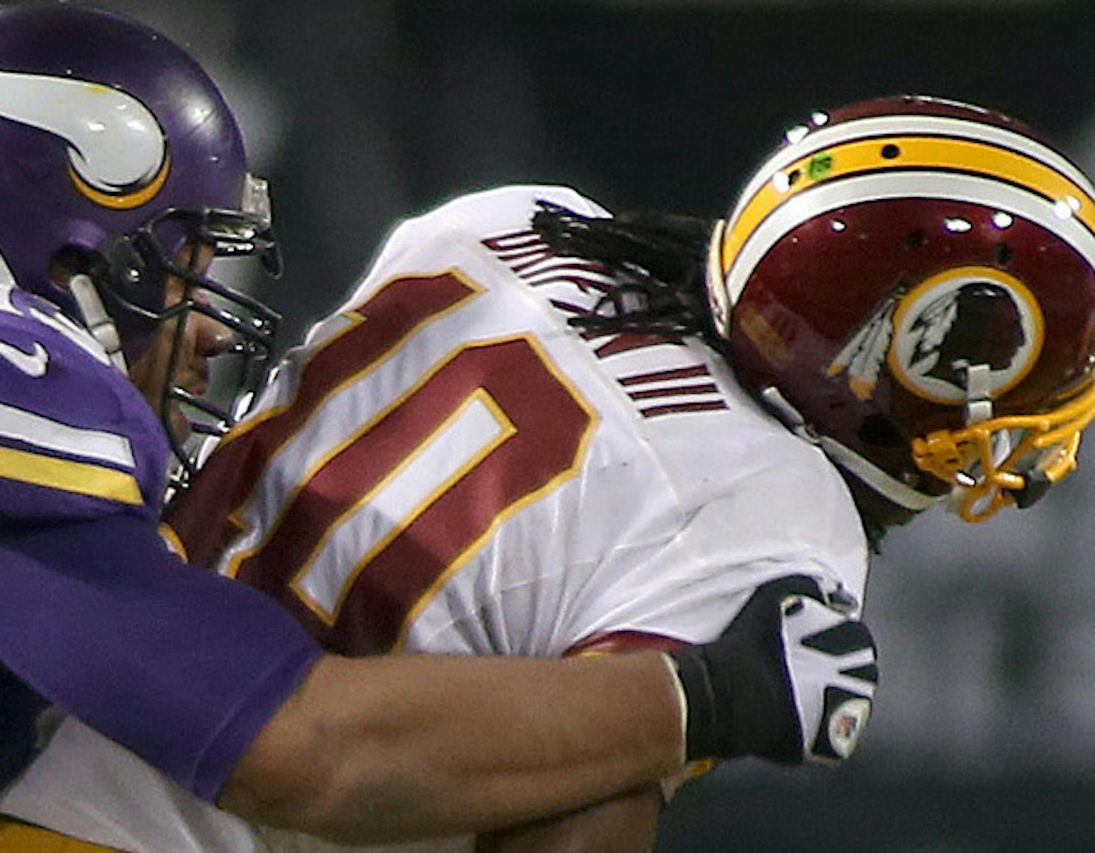 Minnesota Vikings defensive tackle Kevin Williams (93) tacked Washington Redskins quarterback Robert Griffin III (10) for a sack in the third quarter as the Vikings took on the Washington Redskins, Thursday, November 7, 2013 at Mall of America Field in Minneapolis, MN. (ELIZABETH FLORES/STAR TRIBUNE) ELIZABETH FLORES ¬• eflores@startribune.com ORG XMIT: MIN1311072257189168