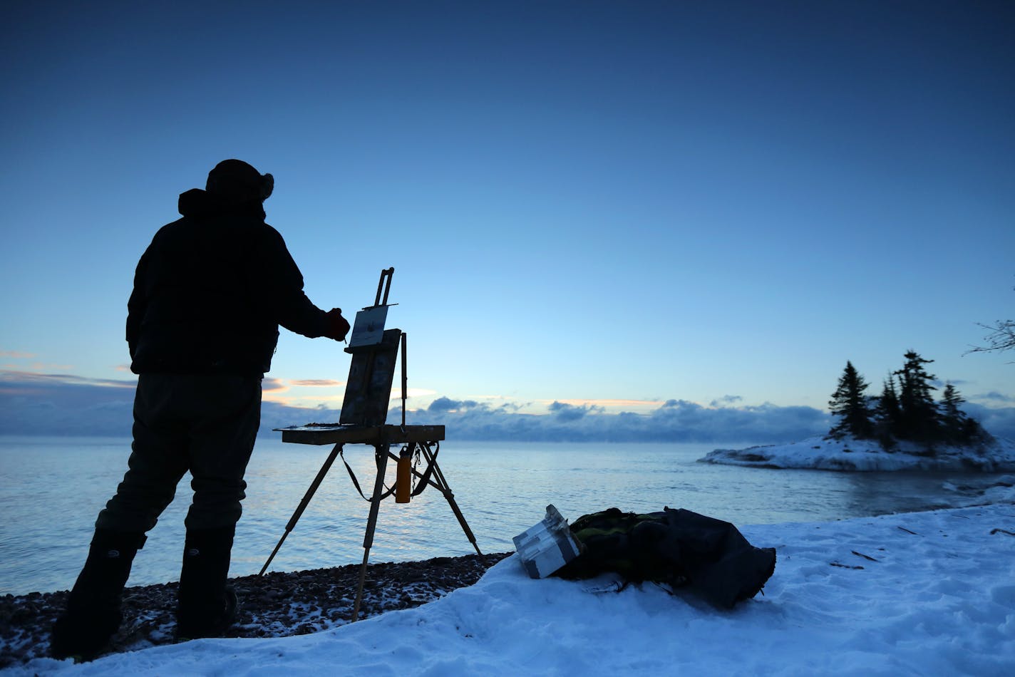 Plein Air painter Neil Sherman, ventures into the outdoors, even in the extremes, to paint and create. Here, Sherman arrives at the break of day, with temperatures hovering around -8 degrees, to capture the feeling of the places he paints. ] brian.peterson@startribune.com
Grand Marais, MN 01/08/17