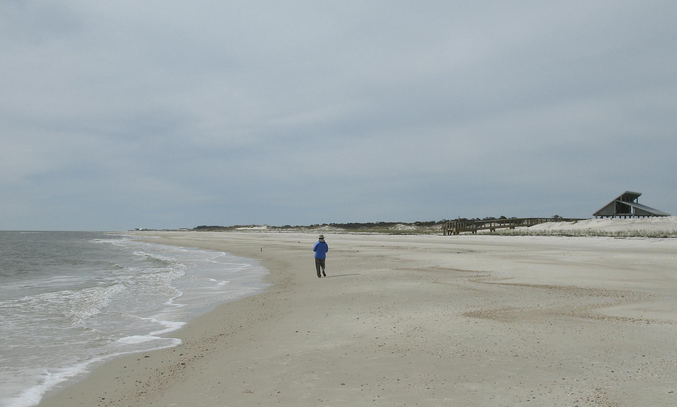 ** FOR IMMEDIATE RELEASE ** Miles of empty beach and billions of sea shells await a lone beachcomber at St. George Island State Park near Apalachicola in the Florida Panhandle on Feb. 5, 2007. Itís called the Forgotten Coast because Floridaís winter tourists tend to prefer the warmer beaches of south Florida, but for tourists from the far north, sunny days in the 50's and 60's can seem like spring, and without any crowds. (AP Photo/William Kronholm) (Beth ñ if you need an ID, the