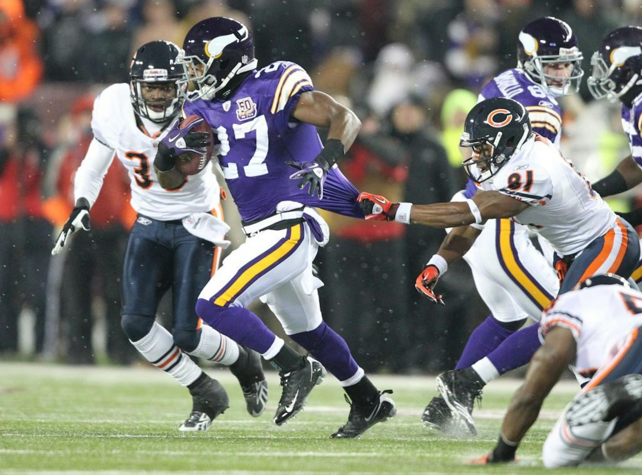 Bears Rashied Davis grabs Lorenzo Booker in the second quarter.