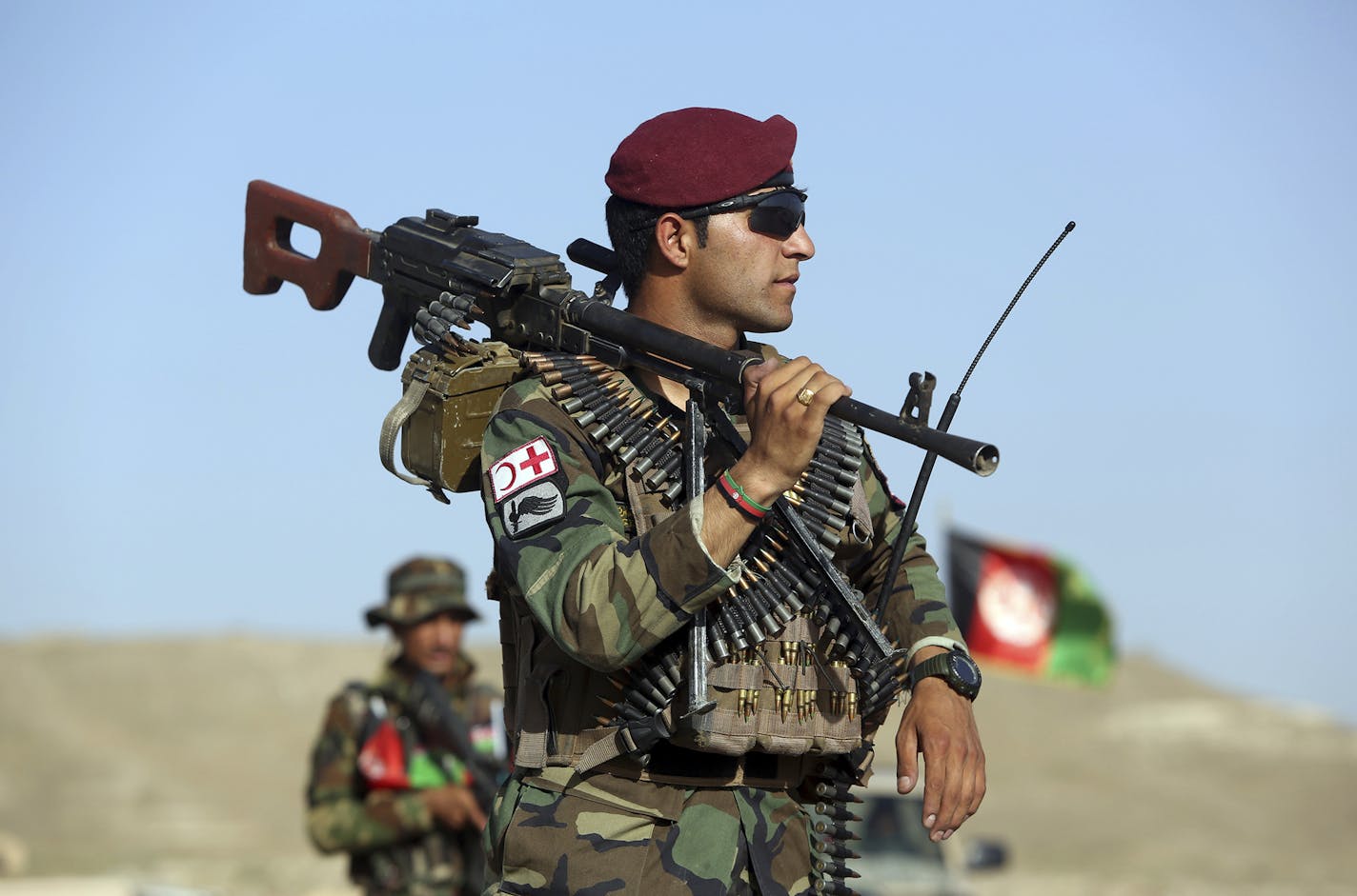 Afghan National Army soldiers stand guard at a checkpoint on the outskirts of Kabul, Afghanistan, Monday, Aug. 21, 2017. Deep in the mountains of eastern Afghanistan, on the front lines against Taliban and Islamic State fighters, U.S. military commanders say they needs more forces to better train Afghan soldiers to combat the escalating threat. They&#xed;re hoping President Donald trump heeds their calls when he outlines his new war strategy Monday. (AP Photo/Rahmat Gul) ORG XMIT: MIN20170822133