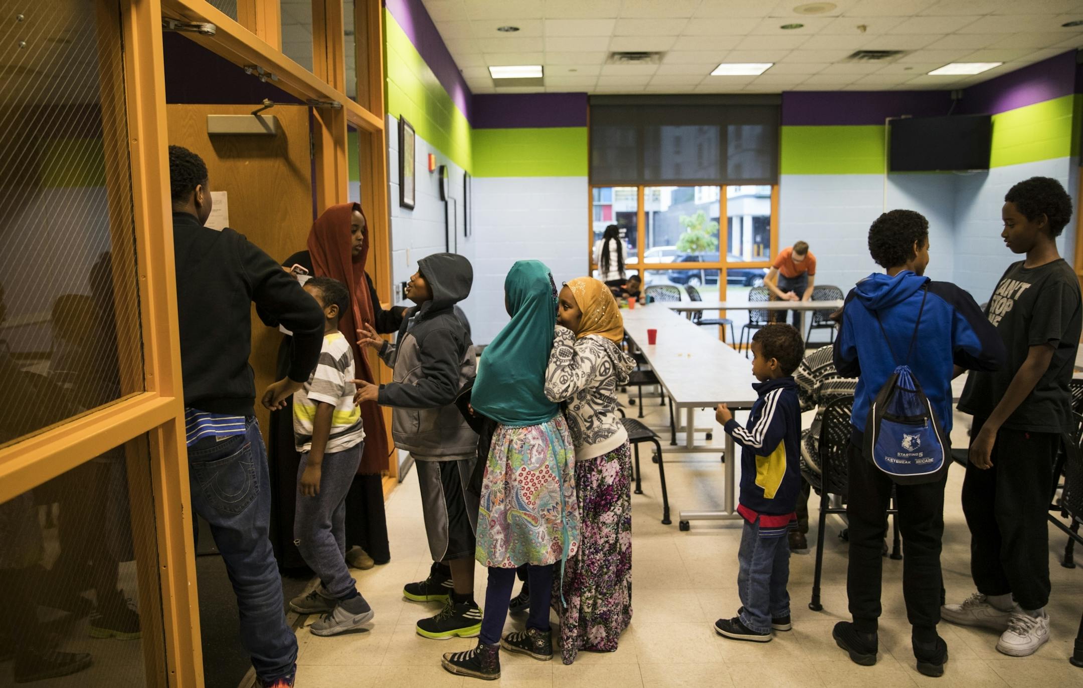 A group of children in the after school program lined up for a field trip after eating dinner at the Brian Coyle Center on Tuesday, October 25, 2016, in Minneapolis, Minn.