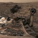 This composite image from Aug. 9, 2018 photos made available by NASA shows the Curiosity rover at Vera Rubin Ridge on Mars. A thin layer of dust is vi