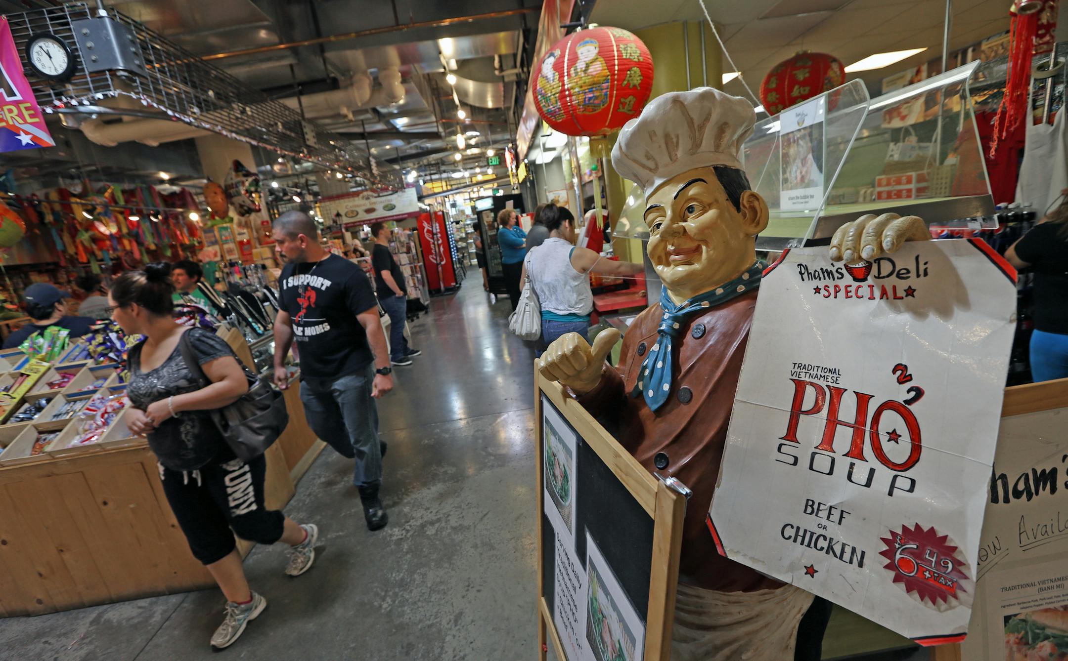 People milled through the Midtown Global Market during the lunch hour, which Mayor Rybak touts as one of his biggest achievements. The market was conceptualized 10 years ago this summer. The market has had its share of problems -- tenant turnover, squabbling among business owners -- but it's going strong and has significantly reduced crime in the Lake/Chicago area.] Bruce Bisping/Star Tribune bbisping@startribune.com