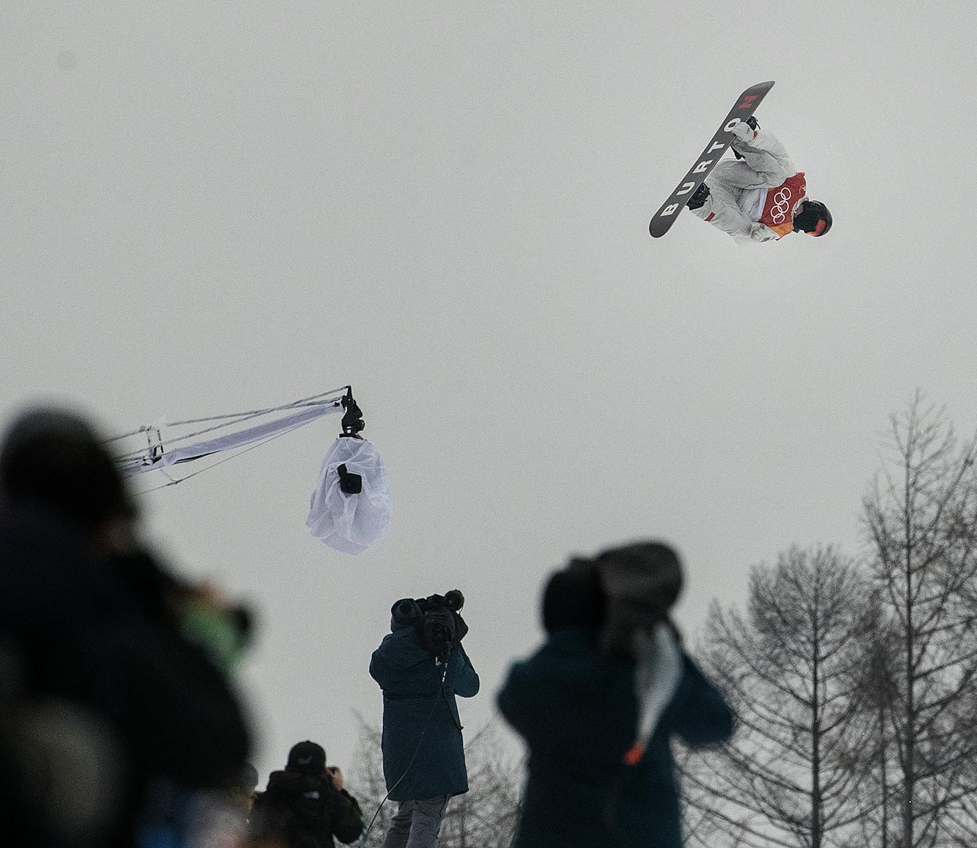 Shaun White during his final run. Shaun White continued Team USA's dominance in snowboarding events at the Olympic Winter Games PyeongChang 2018 by claiming the gold medal in men's snowboard halfpipe Wednesday morning at Phoenix Snow Park. It is the 100th gold medal won by Team USA in Olympic Winter Games history. The leader after first runs with a score of 94.25, White was displaced by Japan's Ayumu Hirano, who upped the ante with a second run of 95.25. That set up the drama of White's final ru