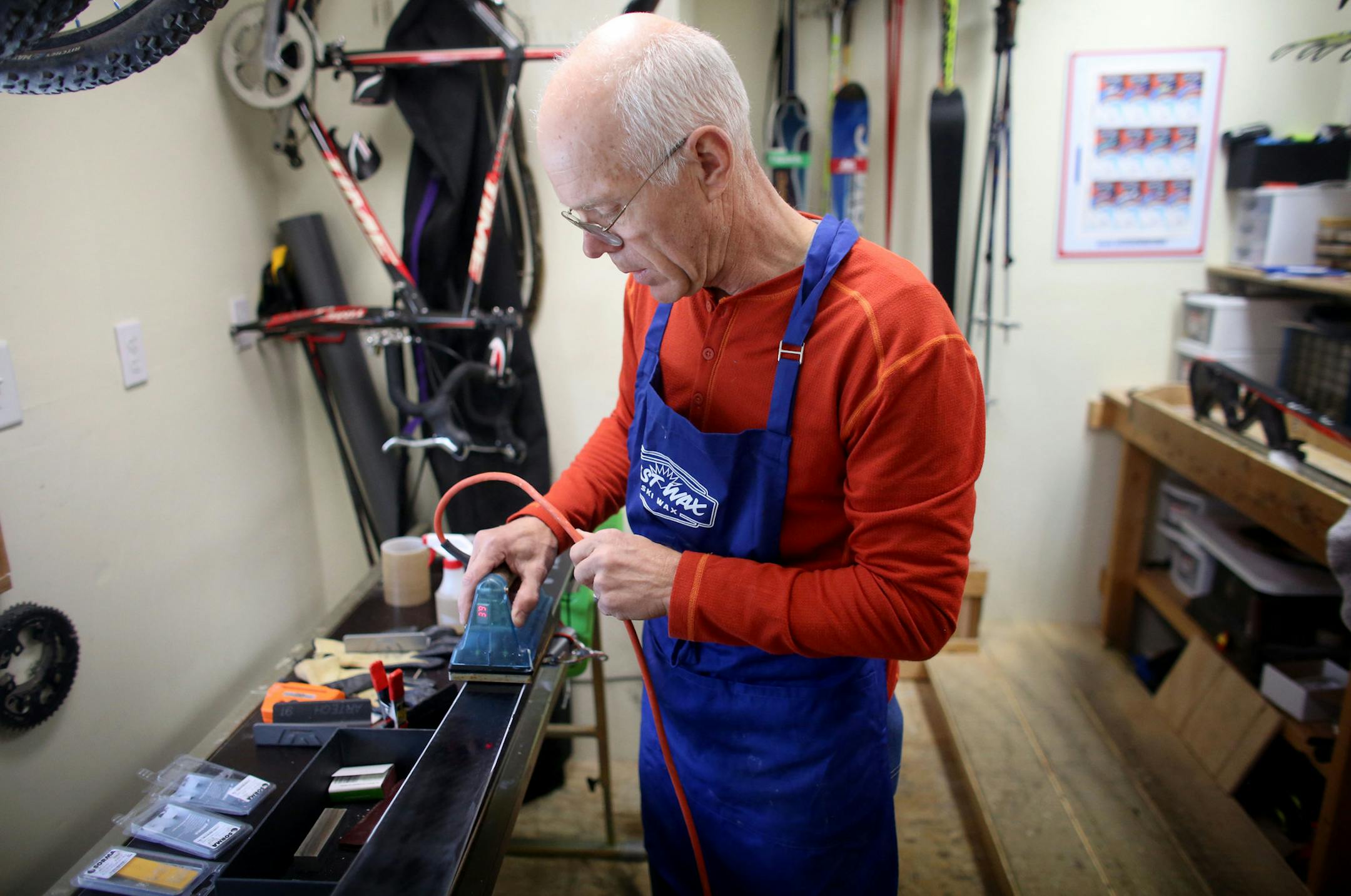 Dan Meyer worked in his little shop as he demonstrated shaping a waxing an alpine ski Fast Wax. ] (KYNDELL HARKNESS/STAR TRIBUNE) kyndell.harkness@startribune.com Fast Wax, a Lake Elmo ski wax company that makes wax for the U.S. Olympic ski team among others in Lake Elmo , Min., Tuesday, November 19, 2014.