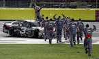 Austin Dillon, left, celebrated with his crew after winning the Coca-Cola 600 at Charlotte Motor Speedway in Concord, N.C., on Sunday.