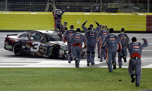 Austin Dillon, left, celebrated with his crew after winning the Coca-Cola 600 at Charlotte Motor Speedway in Concord, N.C., on Sunday.