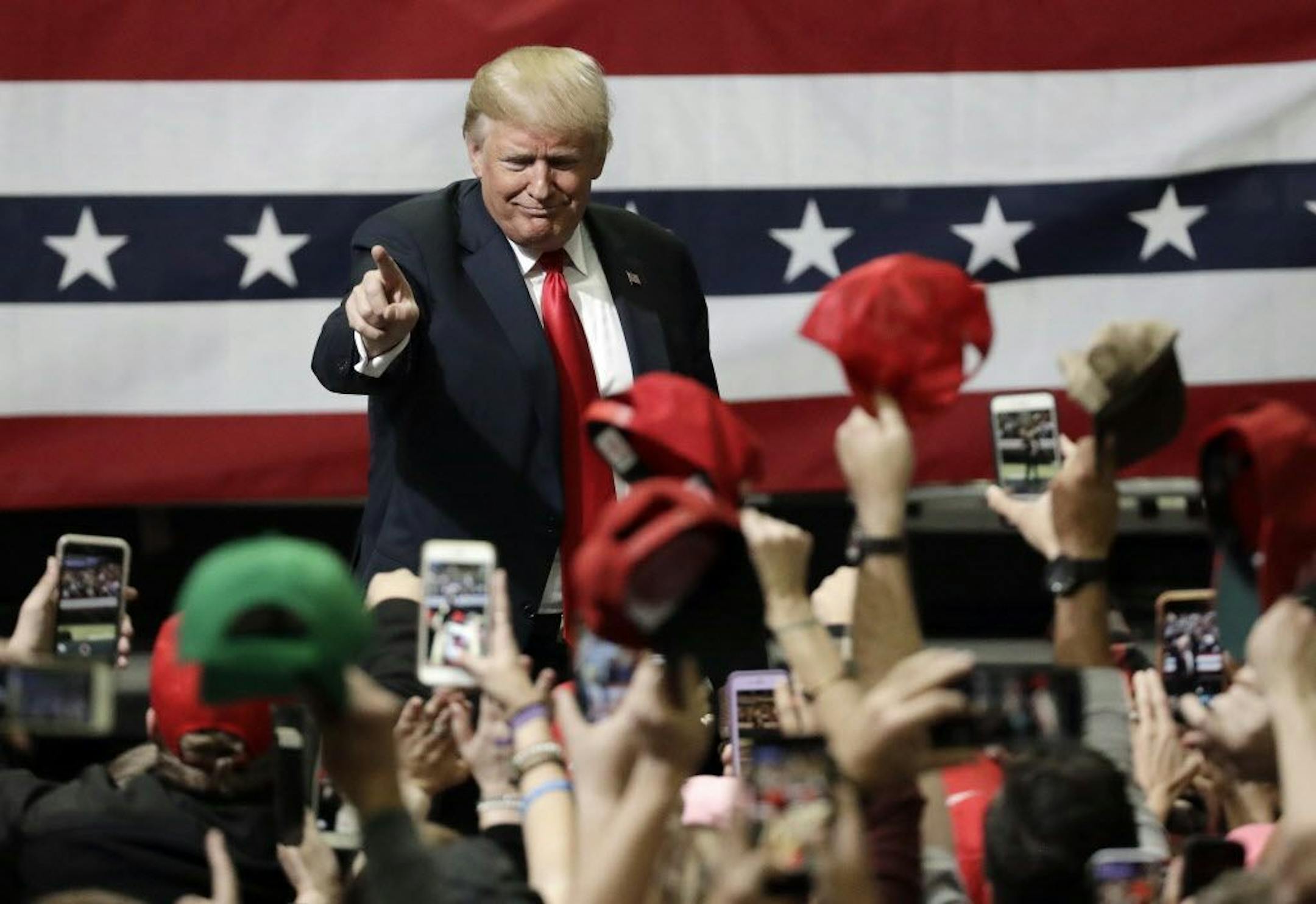 President Donald Trump acknowledges the crowd as he leaves a rally Sunday, Nov. 4, 2018, in Chattanooga, Tenn.