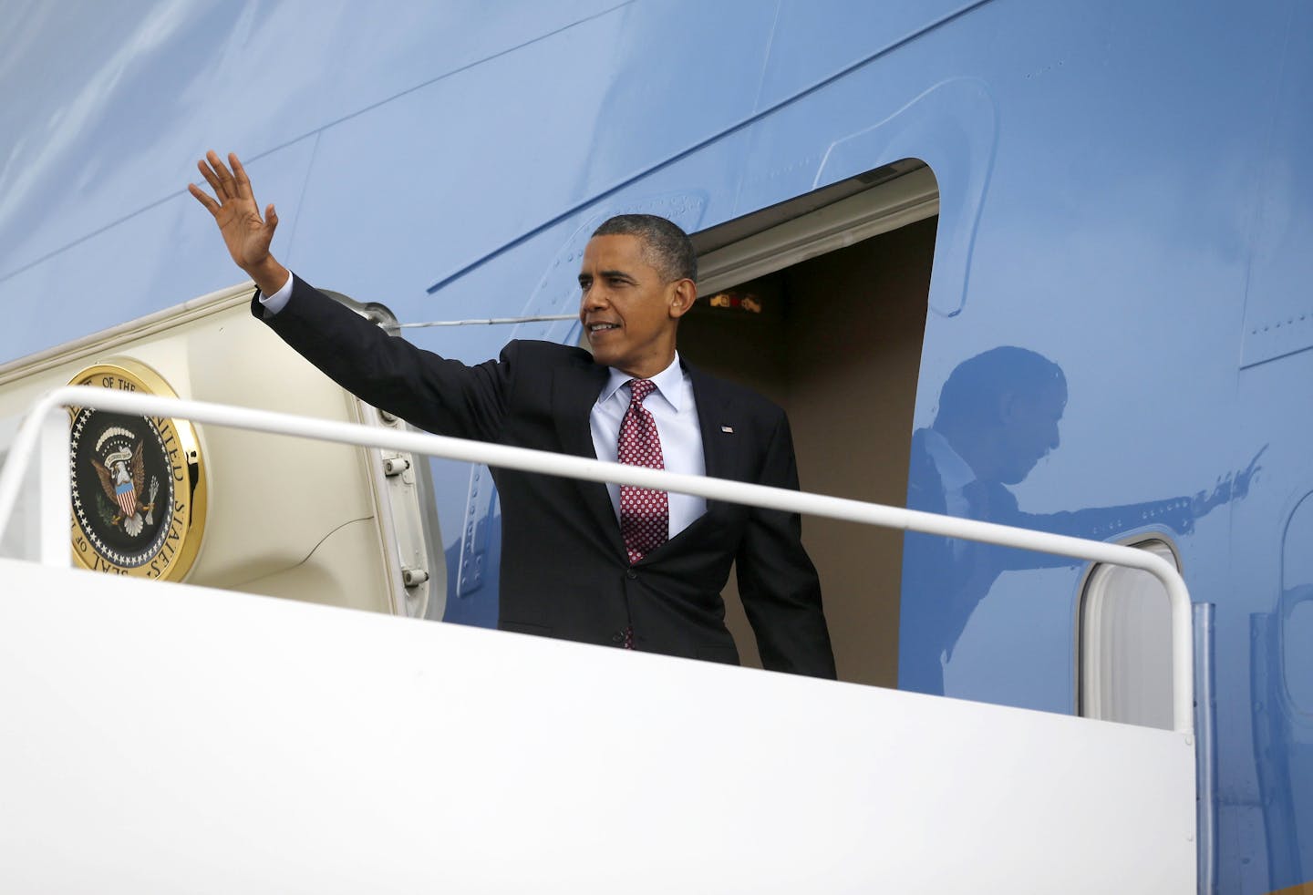 President Barack Obama waves as he boards Air Force One before his departure from Andrews Air Force Base, Md., Wednesday, Sept., 5, 2012. Obama is traveling to Charlotte, N.C., for the Democratic National Convention.