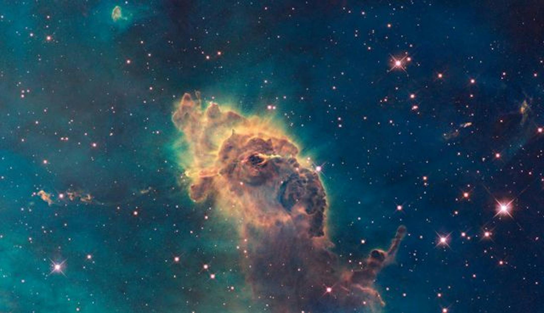 This undated handout image provided by NASA, released Wednesday, Sept. 9, 2009, taken by the refurbished Hubble Space Telescope, shows stars bursting to life in the chaotic Carina Nebula.